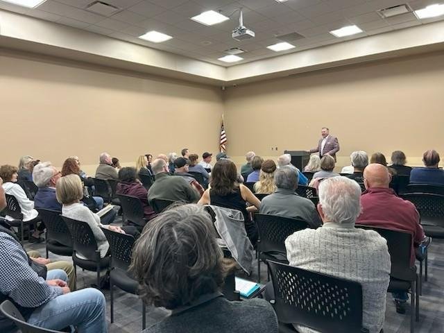 Neighbors gathered in a community meeting room